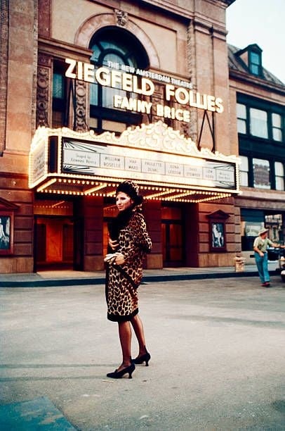 American actress and singer Barbra Streisand stands outside a theater 2